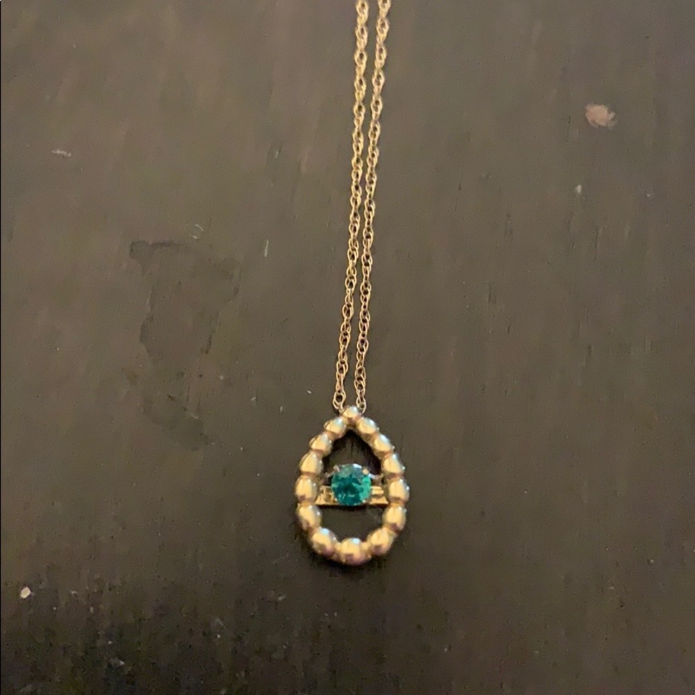 10k spinning emerald pendant necklace